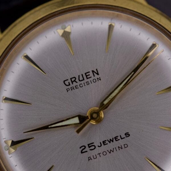 Close-up of the Gruen Precision 25 Jewels Autowind Sunburst Dial, showcasing gold hands and markers with 25 Jewels Autowind on the dial.