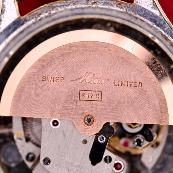 Close-up of a Mido Multifort Grand Luxe Super Automatic 14k Gold Capped watch movement, engraved with Mido, Swiss, Limited, and 917R—highlighting the exquisite craftsmanship of the Multifort collection.