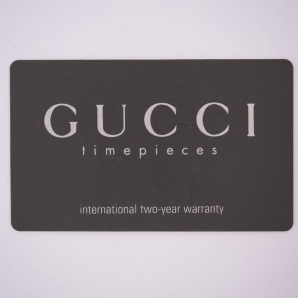 Black card with GUCCI timepieces, including Gucci 5500L Stainless Steel Quartz Box & Papers, and an international two-year warranty printed in white.
