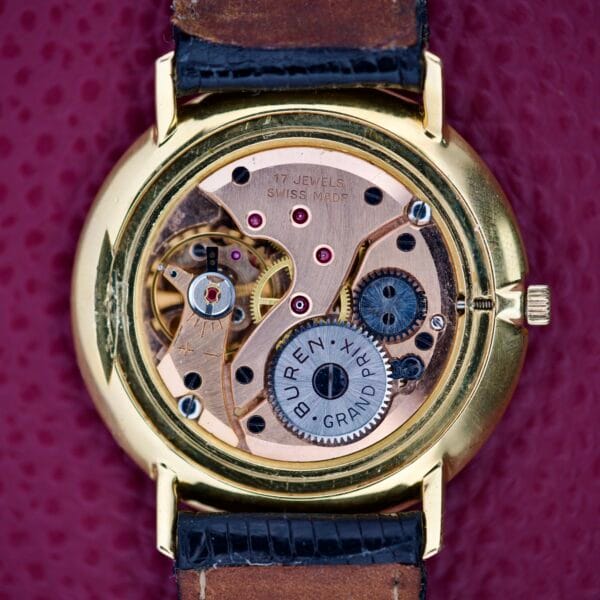 Close-up of a vintage Buren Grand Prix watch movement with visible gears and details, showcasing craftsmanship similar to the Bucherer Disco Volante Thin Manual Wind Caliber 280.