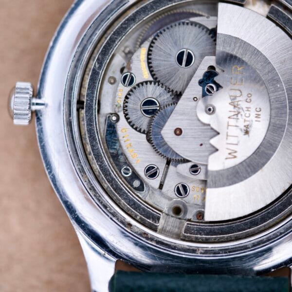 Close-up of the Wittnauer Pert-O-Graph Ref. 7005’s exposed gears and inner workings, highlighting its Rare Pert-O-Graph Scale Bezel.