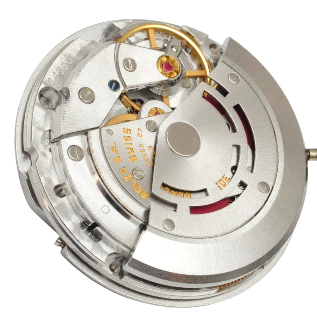 Close-up of a mechanical watch movement with visible gears and intricate metal components.
