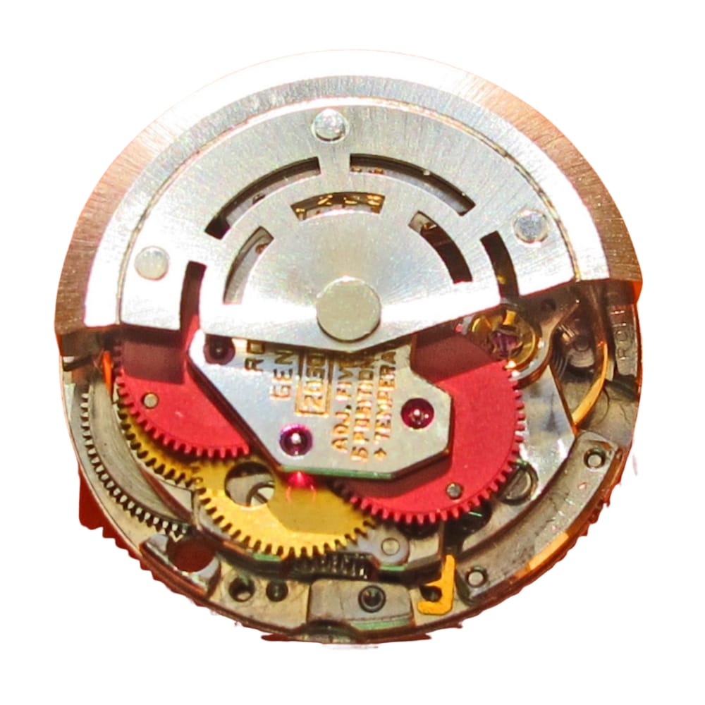 Close-up of a mechanical watch movement with visible gears and intricate metal components.