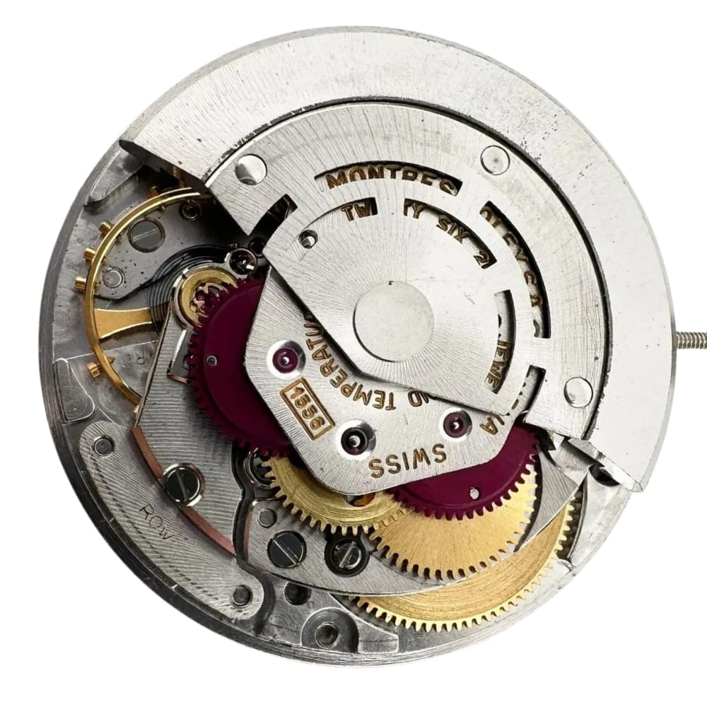 A close-up of a mechanical watch movement with visible gears and metal components.