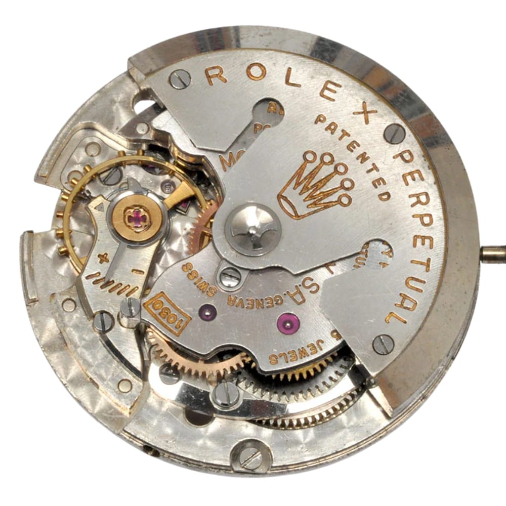 Close-up of a Rolex watch movement showing intricate gears, jewels, and the engraved Rolex crown logo.
