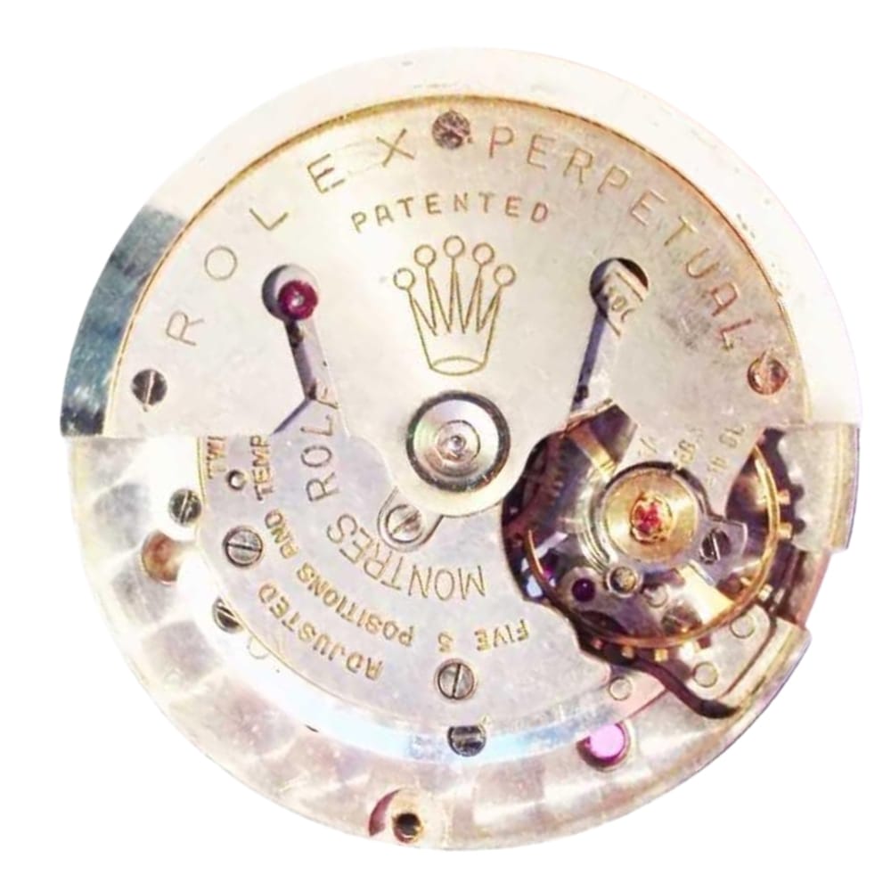 Close-up of a Rolex watch movement showing intricate gears and engraved text, including the Rolex crown logo.
