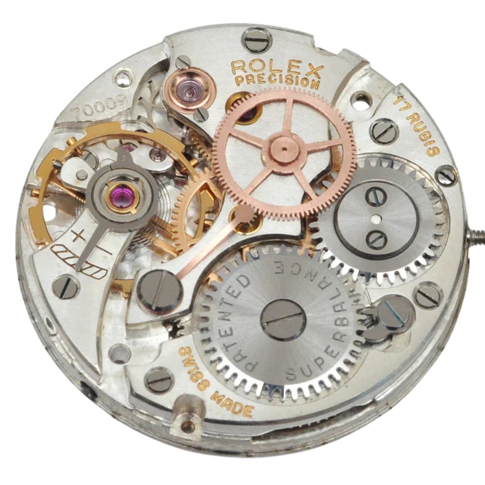 Close-up of a Rolex watch movement showing intricate gears and components marked with Rolex Precision.