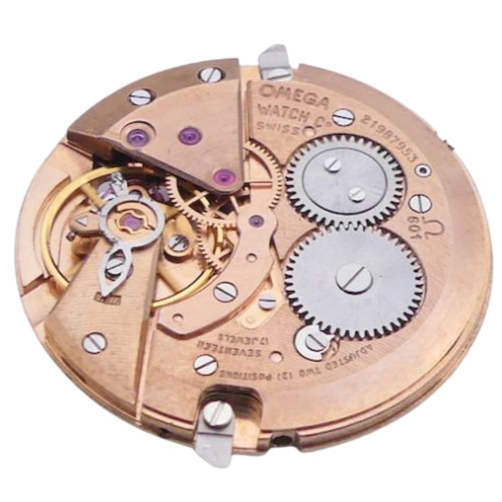 Close-up of a vintage Omega watch movement with visible gears, screws, and engraved text.