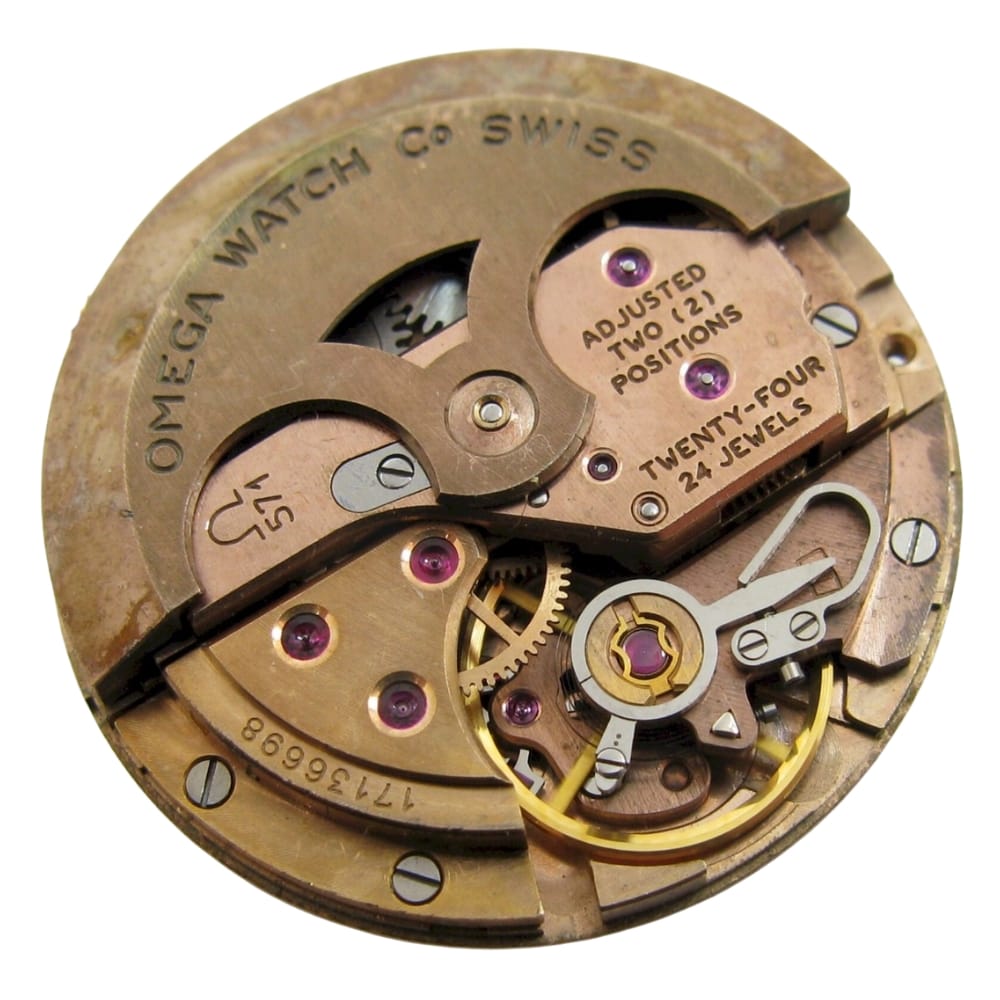 Close-up of a vintage Omega Swiss watch movement, showing gears, jewels, and engraved markings.
