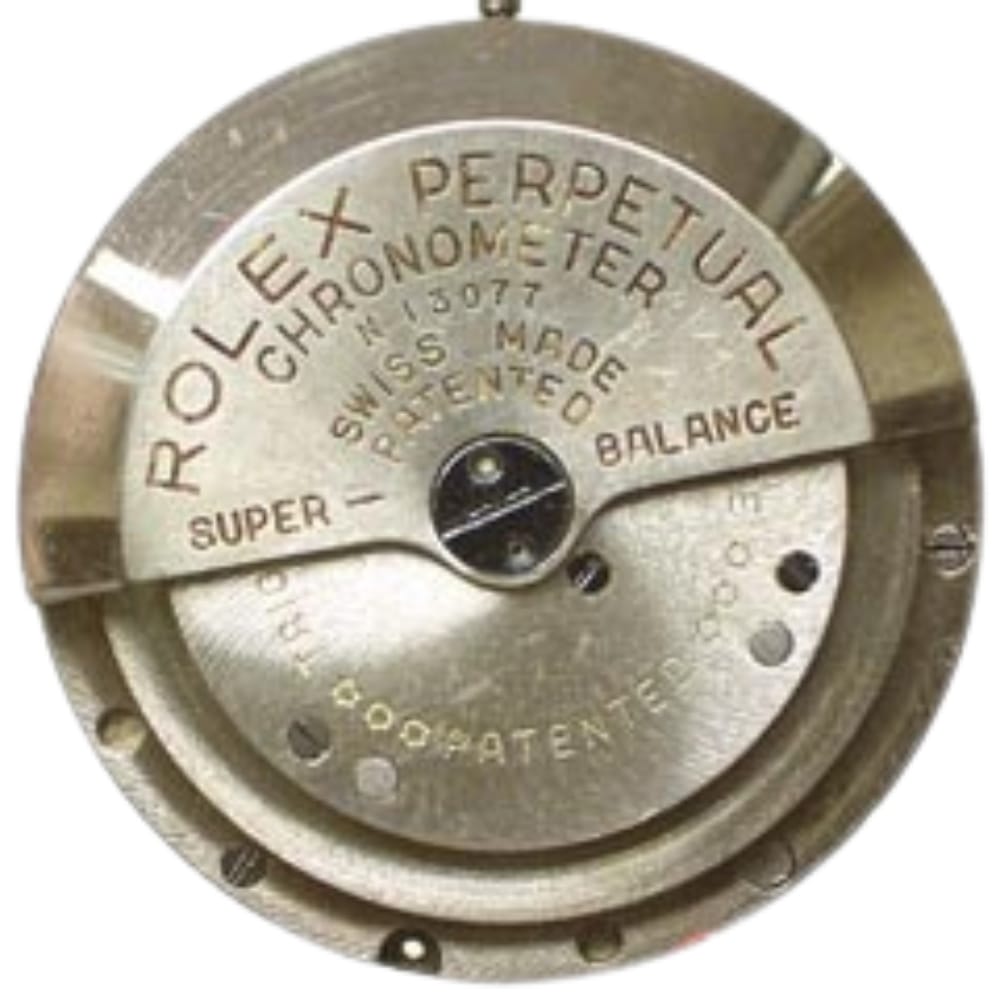 Close-up of a vintage Rolex Perpetual Chronometer watch movement with engraved text and metal details.
