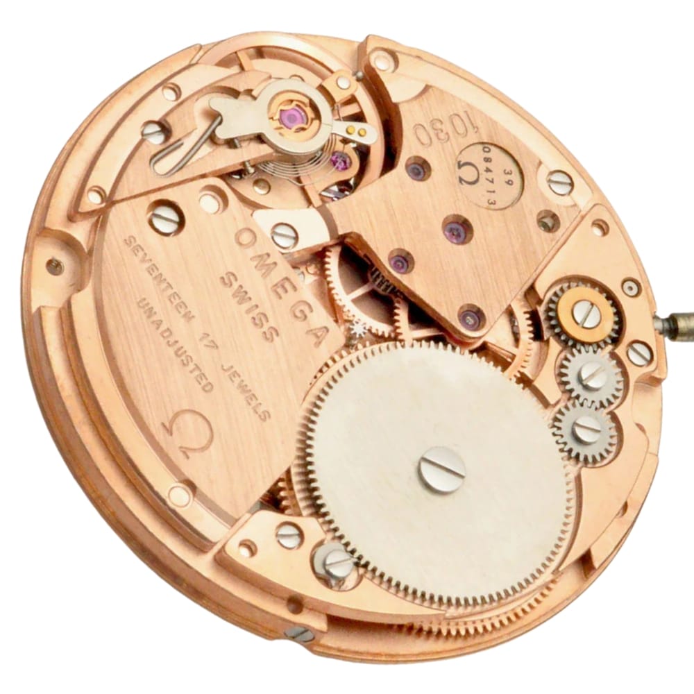 Close-up of an Omega Swiss mechanical watch movement showing gears, jewels, and intricate metal parts.
