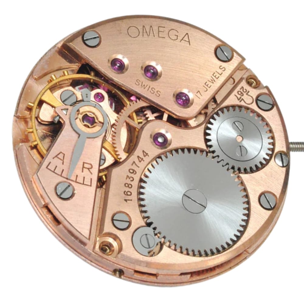 Close-up of an Omega watch movement showing gears, jewels, and engraved markings on metal parts.