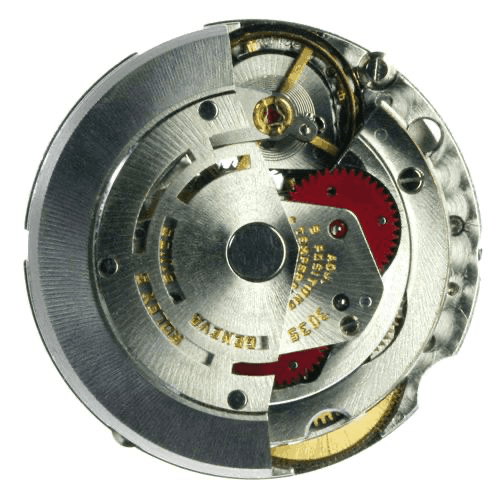 Close-up of a mechanical watch movement with gears and metal components visible.