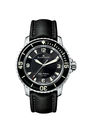 Black Blancpain Fifty Fathoms 5015-1130-52A wristwatch with a round face, white markers, and a black leather strap, displaying the time 10:10—a luxury dive watch embodying timeless sophistication.