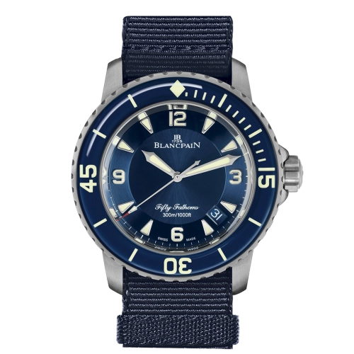 Blue Blancpain Fifty Fathoms luxury dive watch with a navy strap, large numerals, and a rotating bezel, model 5015-12B40-NAOA, showing 10:10 time.