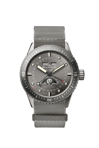A Blancpain Fifty Fathoms 5054-1210-NAGA wristwatch with a gray strap, black bezel, and moon phase display on the dial.