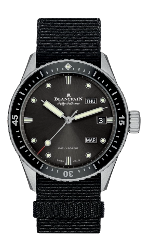 A black Blancpain Fifty Fathoms luxury watch, model 5071-1110-NABA, features day, date, and month displays on a sleek black nylon strap.