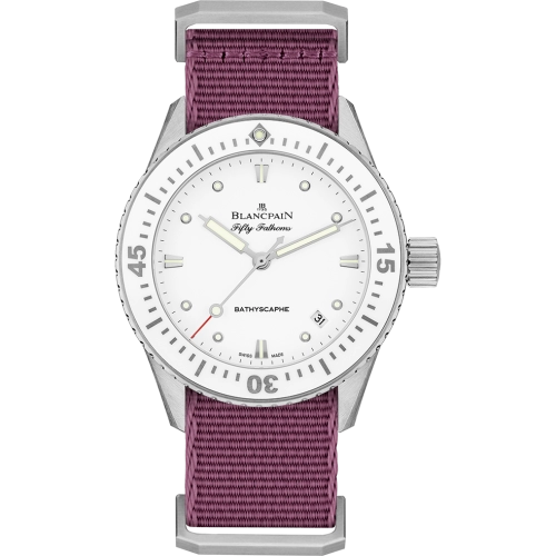 A Blancpain Fifty Fathoms watch, model 5100-1127-NAV, with a white dial and purple fabric strap, displays the time 10:10—a luxury dive watch that stands out in any collection.