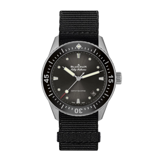 A black Blancpain Fifty Fathoms 5100B-1110-NABA dive watch with a black nylon strap and silver bezel.