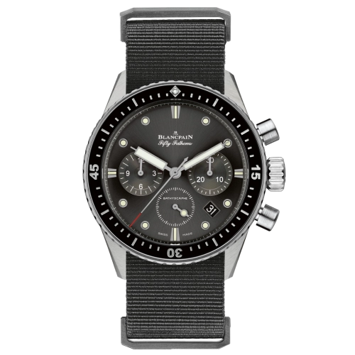 The silver Blancpain Fifty Fathoms 5200-1110-NABA is a luxury watch featuring a black dial with chronograph subdials and a sleek black fabric strap.