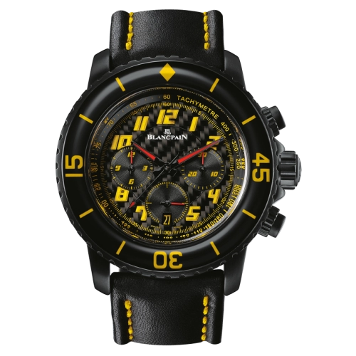 A Blancpain Fifty Fathoms wristwatch in black with yellow accents, tachymeter scale, and a black leather strap featuring yellow stitching.