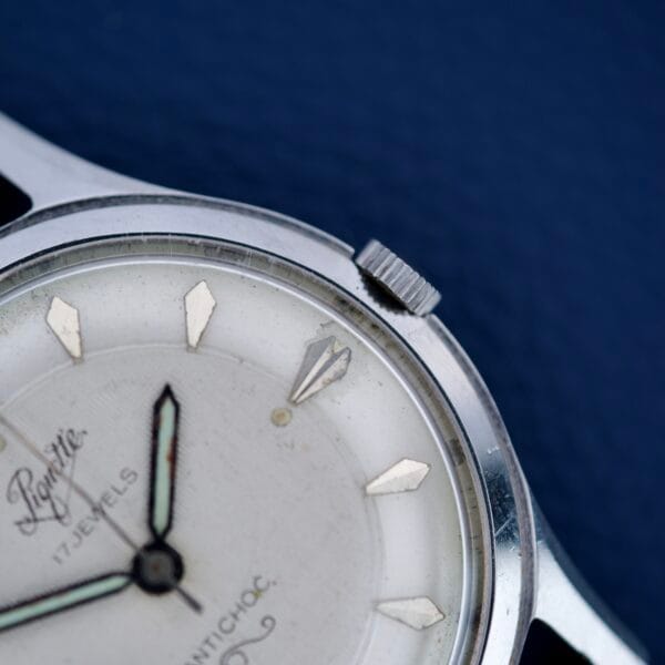 Close-up of the Piguette Antioch 17 Jewels Manual Wind wristwatch, showcasing its stainless steel case, white dial, black hands, and signature vintage design.
