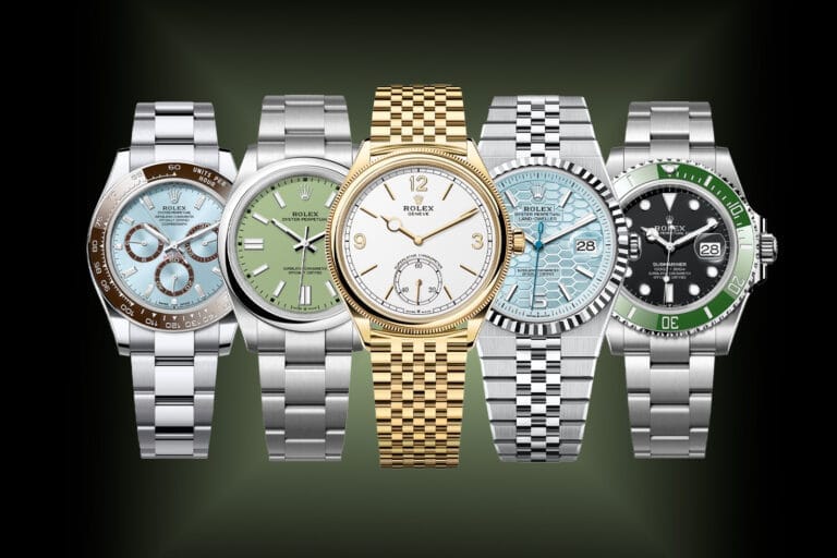 Five luxury Rolex wristwatches, each with distinct colored faces and bands, are displayed side by side on a dark background—perfect for collectors who appreciate unique styles and authentic Rolex serial numbers.