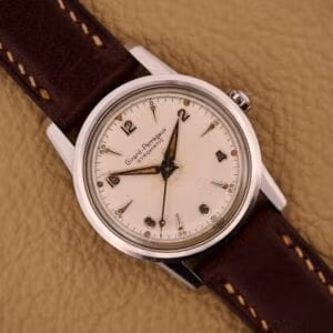 Vintage Girard Perregaux Gyromatic ref. 6678 in stainless steel with aged cream dial on brown leather strap.