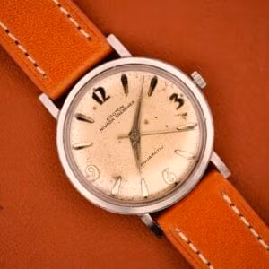 Vintage Croton Nivada Grenchen Aquamatic dial straight-on, freckled silver Explorer-style face on tan leather strap