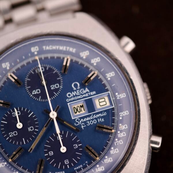 Close-up of an Omega Seamaster Speedsonic F300 Ref. 188.0002 chronograph with original bracelet and Spanish date display.