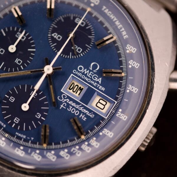 Close-up of an Omega Seamaster Speedsonic F300 Ref. 188.0002 chronograph with original bracelet, showing the Spanish date feature with day as DOM and date as 8.