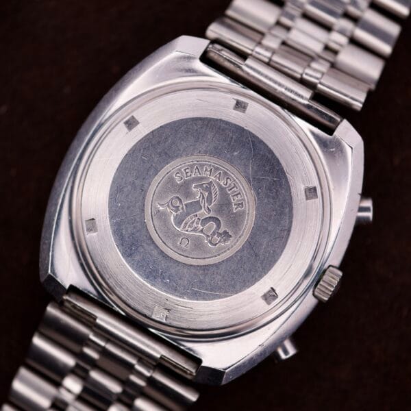 Silver watch back engraved with a seahorse, Omega Seamaster, and Omega logo; Omega Seamaster Speedsonic F300 Ref. 188.0002 Chronograph on original metal bracelet with Spanish date display.