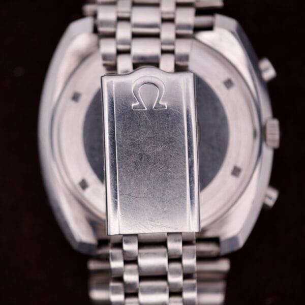 Close-up of the Omega Seamaster Speedsonic F300 Ref. 188.0002 Chronograph's original bracelet clasp, featuring the engraved Omega logo and Spanish date display.