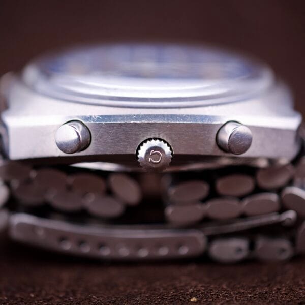 Close-up side view of a silver Omega Seamaster Speedsonic F300 Ref. 188.0002 Chronograph with original bracelet and Spanish date, highlighting the crown and chronograph buttons.
