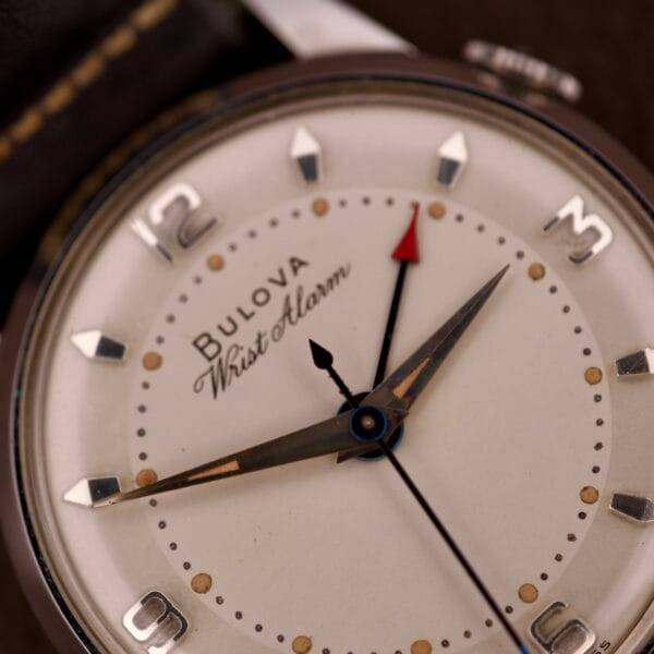 Close-up of a NOS Bulova Wrist Alarm Manual Wind Cal. 11AERC with a white dial, showing the time at about 2:08:33.