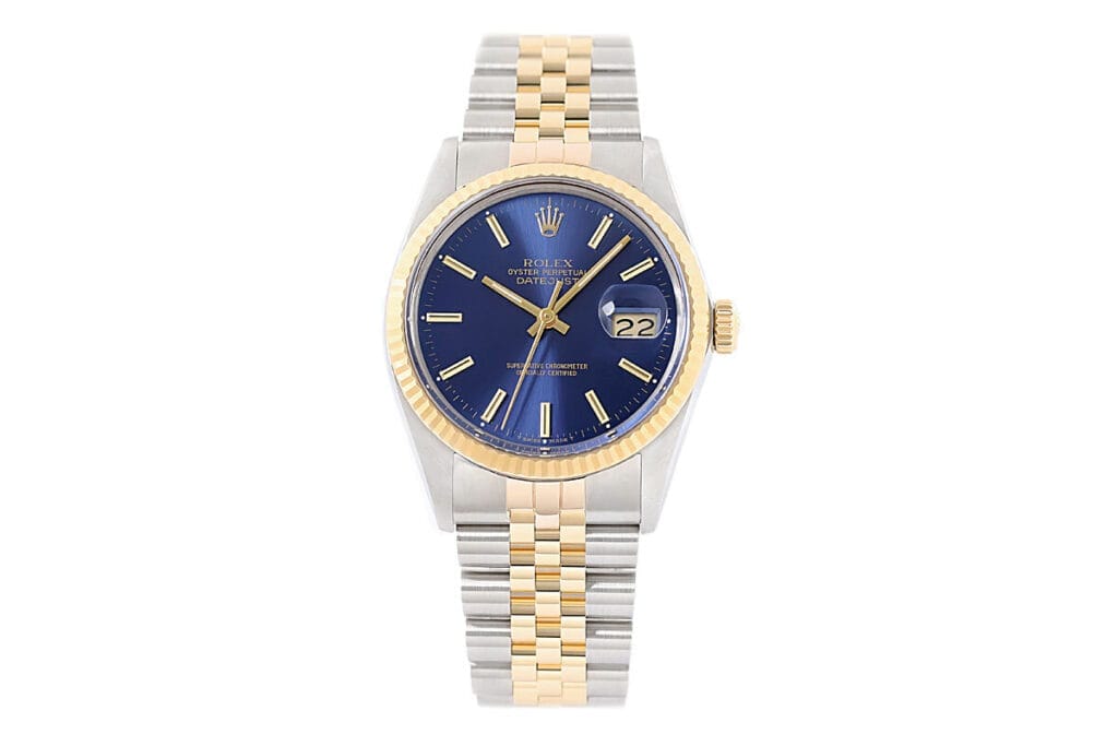 A Rolex Ref. 16013 with a blue sunburst dial and a gold bezel.