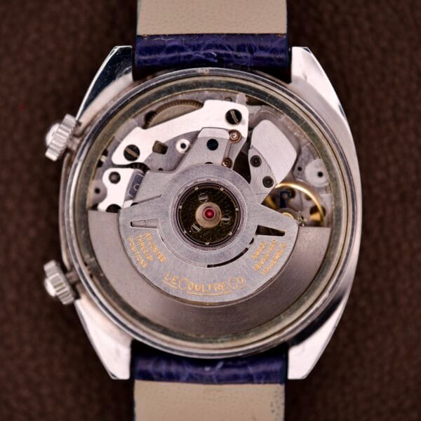 Close-up of the Lecoultre Automatic Memovox Reveil "Egg" Ref. 3072-916 Cal. 916 movement, with “LECOULTRE & CO” engraved on the rotor, highlighting the fine craftsmanship of this renowned watch.