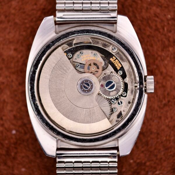 Close-up of the inner mechanism of the Hamilton Automatic HF-36 Day-Date Hi-Beat Cal. 631, revealing its Hi-Beat gears and intricate metal components.