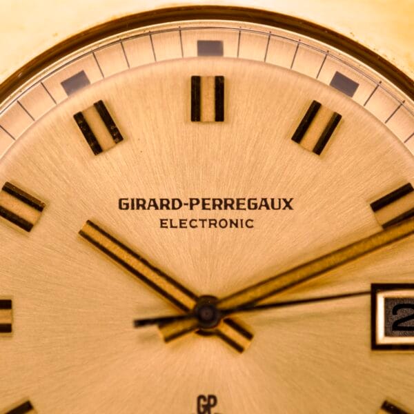 Close-up of the Girard Perregaux Electronic Ref. 9280 6H Large Cushion Case watch face with Roman numerals and gold hands.