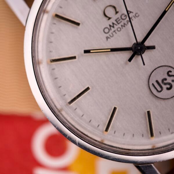 Close-up of an Omega Automatic Seamaster Ref. 166.020 For "U.S. Steel" wristwatch face with black hour markers and hands, powered by the Cal. 1010 movement—Full Set included.