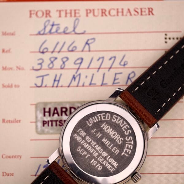 An Omega Automatic Seamaster Ref. 166.020 For "U.S. Steel" Cal. 1010 Full Set with engraved case back is shown atop its certificate featuring handwritten and printed details, emphasizing its Caliber 1010 movement.