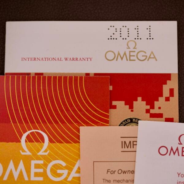 Full set of Omega Automatic Seamaster Ref. 166.020 for "U.S. Steel" Cal. 1010, includes assorted cards and documents, with an international warranty card dated 2011.