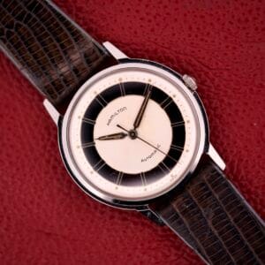 Hamilton Thin-o-matic T-500 Caliber 666 Automatic Micro-Rotor watch with a black and white dial and textured brown leather strap.