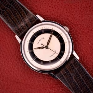 Hamilton Thin-o-matic T-500 Caliber 666 Automatic Micro-Rotor watch with a black and white dial and textured brown leather strap.