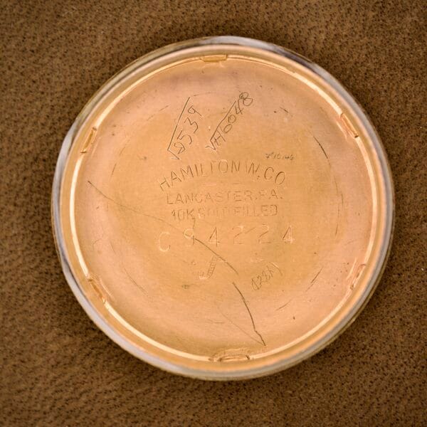 The Hamilton Automatic Ref. K-407 features a classic 10K gold-filled case back engraved with Hamilton W. Co. Lancaster, PA, Cal. 661, and serial numbers—exemplifying vintage Hamilton style.