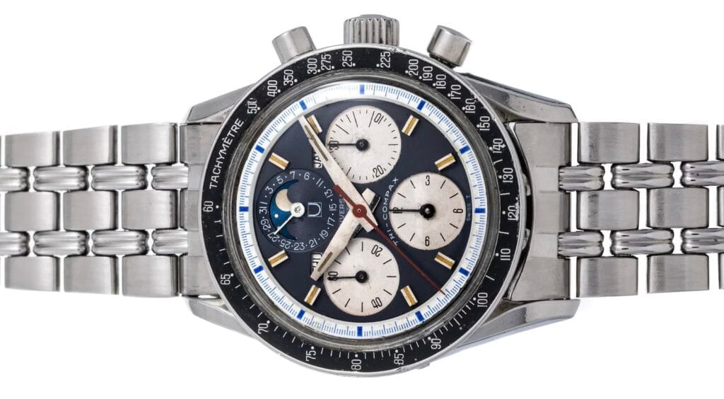 A stainless steel Tri-Compax chronograph wristwatch with a tachymeter bezel and three subdials on a linked metal band.