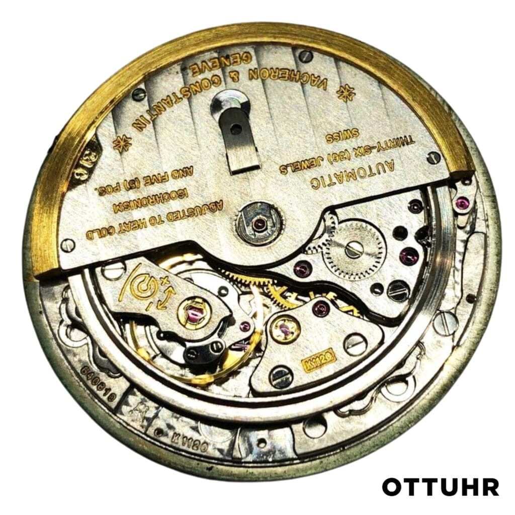 Close-up view of a vintage mechanical watch movement, reminiscent of the Vacheron Constantin K1120 caliber, with visible gears and engraved text, labeled OTTUHR.