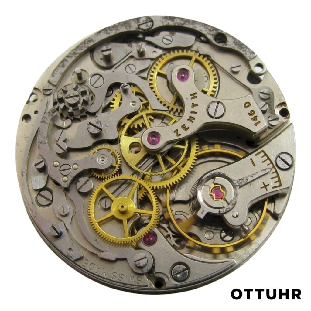 Close-up of an intricate Zenith 146H mechanical watch movement with visible gears and components, labeled ZENITH and SWISS MADE.