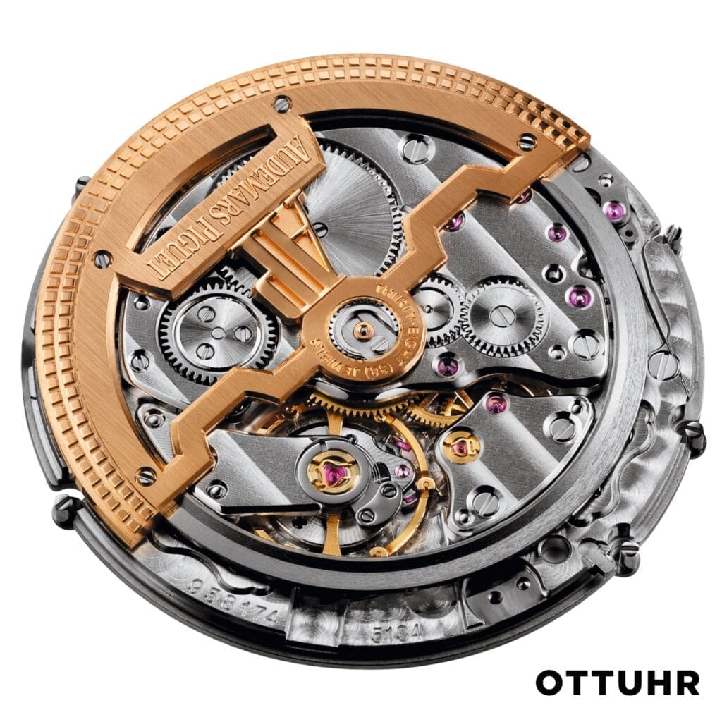 Mechanical watch movement with gold and silver gears, intricate details, and Audemars Piguet 2121 engraved.