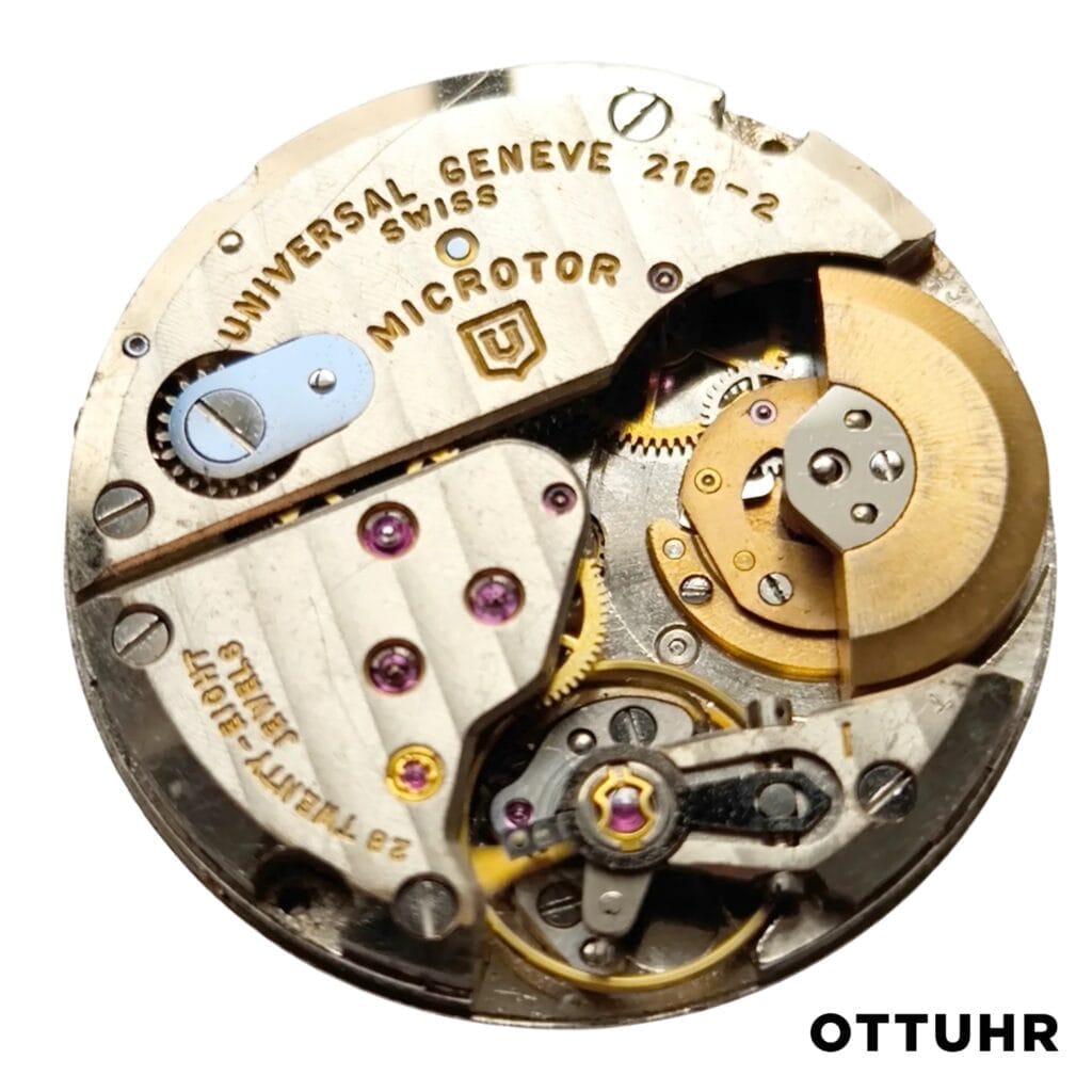 Close-up of a Universal Genève 218-2 Swiss watch movement, highlighting its gears and intricate mechanical parts.